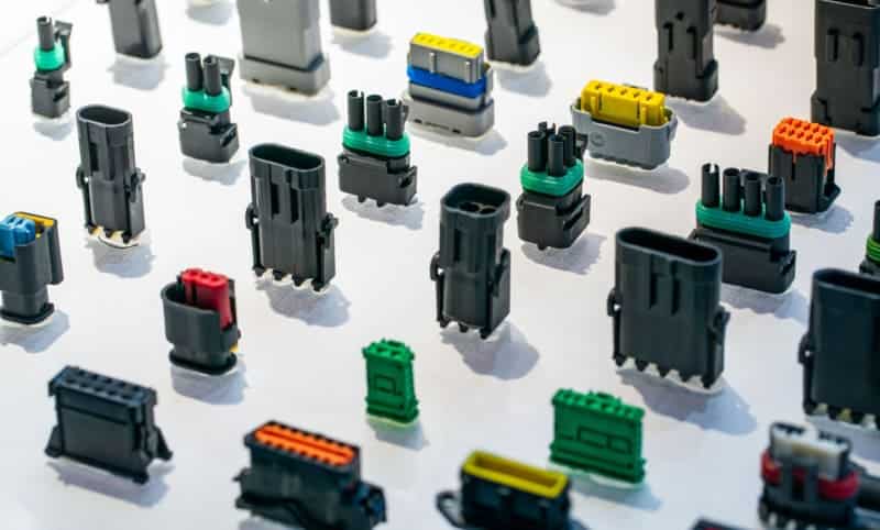 Assorted plastic connectors in various colors and shapes