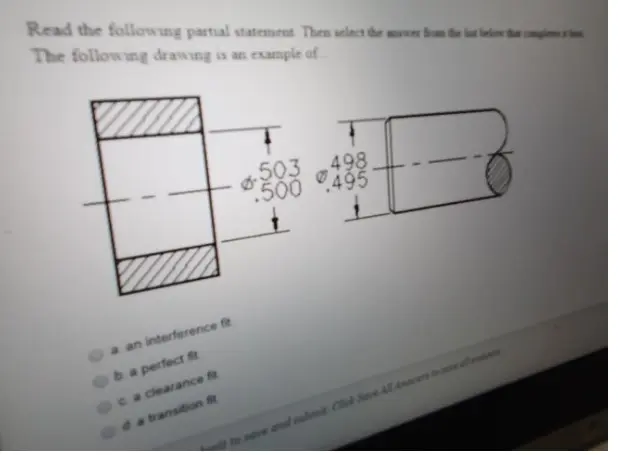 Close-up of a clearance fit shaft and bearing assembly on a metal surface