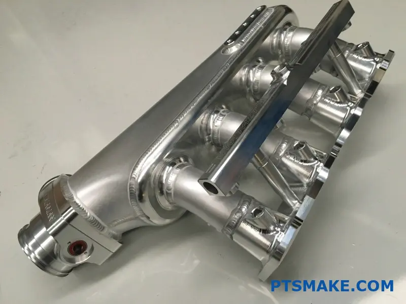 Aluminum intake manifold with precision CNC machining details