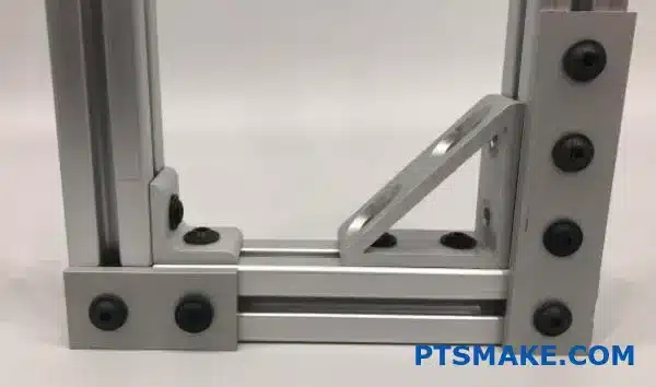 CNC machined aluminum bracket mounted on T-slot profile system