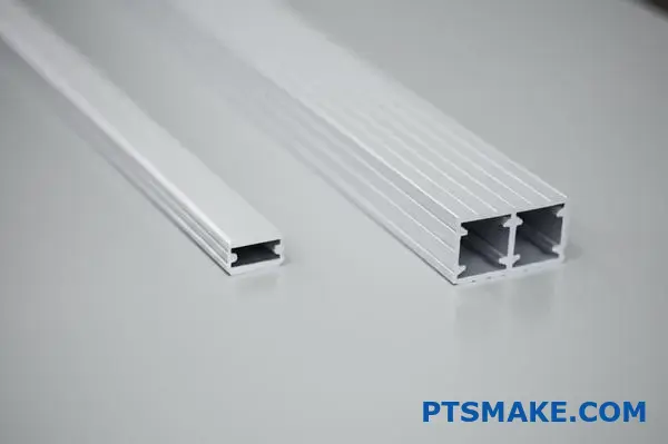Close-up of silver custom aluminum extrusions with precision cutting and smooth finish